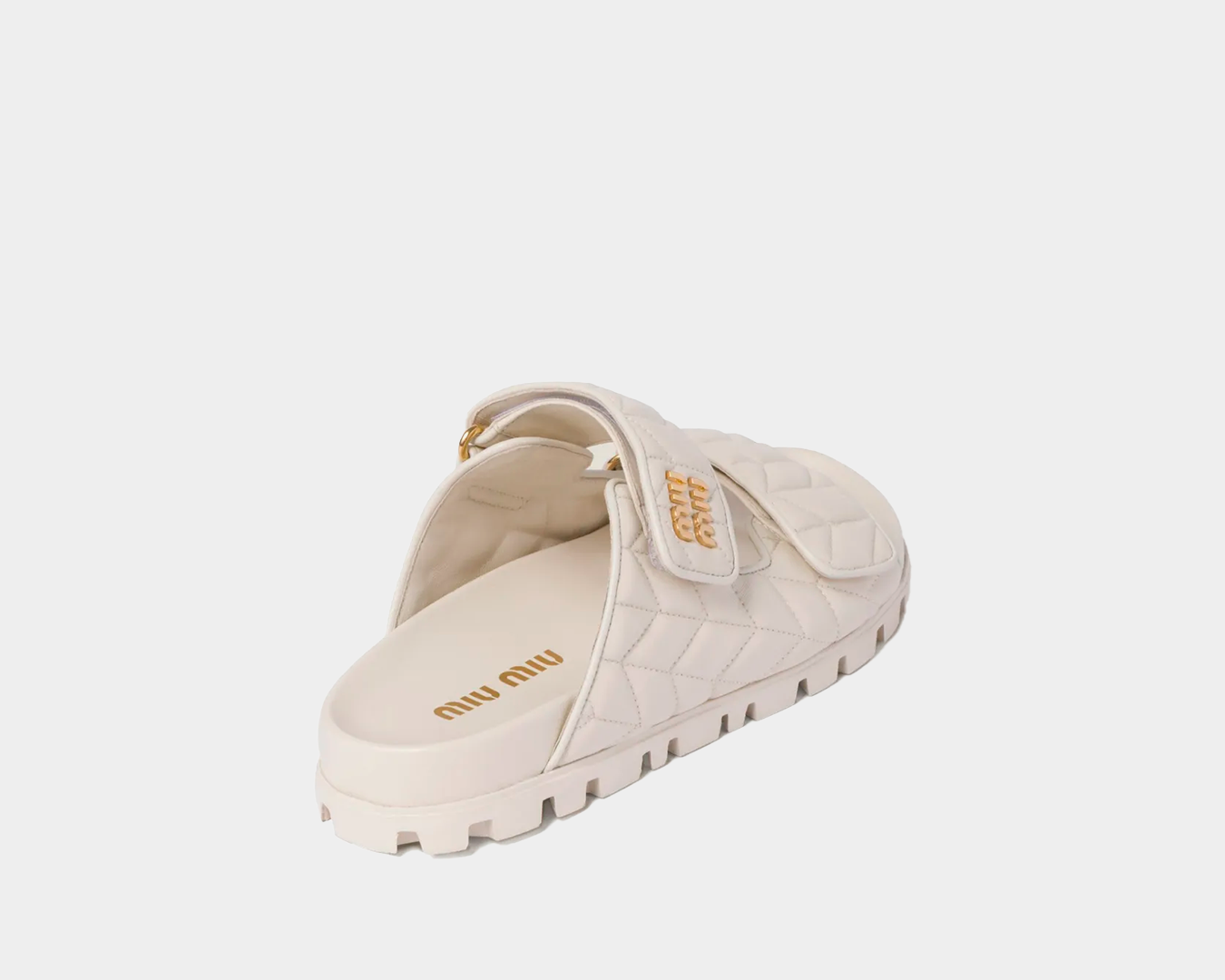 Slide Miumiu Matelassê em couro nappa